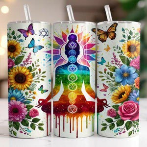 May include: Three white insulated tumblers with straws, adorned with floral and butterfly designs. One features a silhouette with chakra symbols, while the others showcase sunflowers, roses, and butterflies. The tumblers are designed for cold beverages.