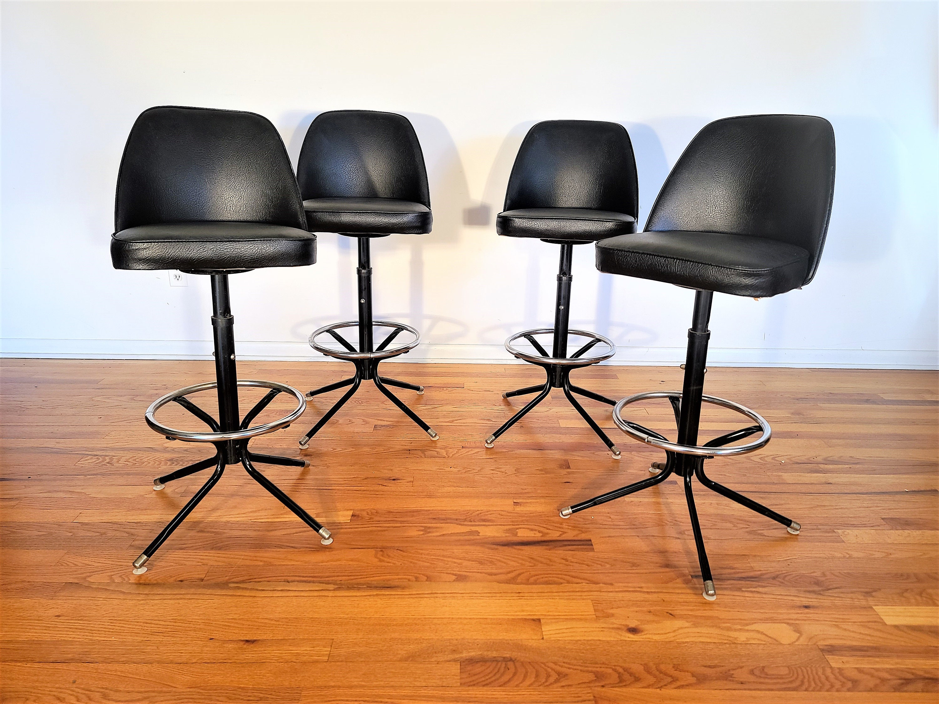 Mid Century Set of Four Swivel and Adjustable Bar Stools