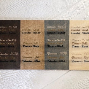 May include: Four wood samples with different wood stains and text showing the font names "Lucida", "Times", and "Edwardian" in different styles: no fill, gold, and black.