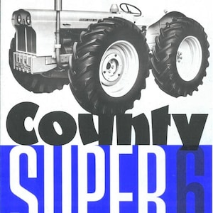 May include: A black and white photograph of a County Super 6 tractor. The tractor is light grey and has large black tyres. The tractor is set against a white background. The text "County Super 6" is in large black letters on a blue background.