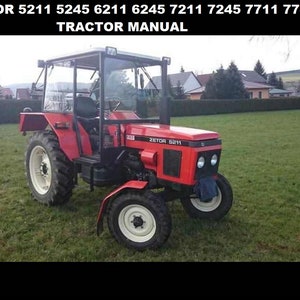 May include: A red Zetor 5211 tractor with a roll cage and a clear plastic canopy. The tractor is parked on a grassy field.