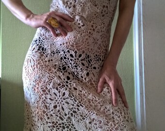 The dress is crocheted, Irish lace. Irish knitting.