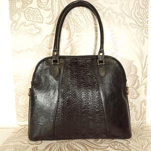 Bolso vintage Texier de piel negra con asa superior y detalle tejido