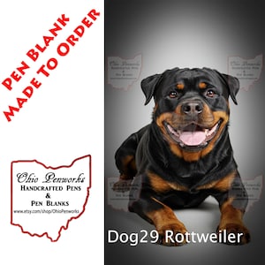 May include: A black and tan Rottweiler dog is lying down on a gray background. The dog is smiling and has its tongue sticking out. The text "Dog 29 Rottweiler" is printed below the dog.