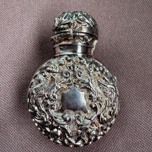 antique perfume bottle in silver case hallmarked Birmingham 1897 Victorian scent bottle repousse silver gilt case blank cartouches 1890s