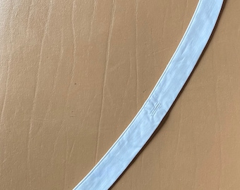 May include: White cotton collar extender with three buttonholes on each end.