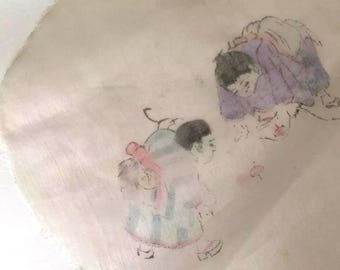May include: A vintage handkerchief with a watercolor illustration of two figures. One figure is carrying another on their back, both in muted colors of purple, pink, and blue. The handkerchief has a delicate, slightly frayed edge.