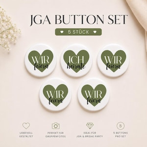 May include: A set of five white circular buttons featuring olive green heart graphics. Four buttons display the text 'WIR feiern' and one button displays 'ICH heirate' in a mix of serif and script fonts. The set is labelled JGA BUTTON SET.
