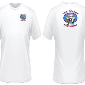 May include: White t-shirt with a blue circle graphic on the back. The graphic features two cartoon chickens with the text "Los Pollos Hermanos".
