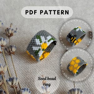 May include: A PDF pattern for a seed bead ring featuring three distinct designs: a white daisy on a gray background, a yellow and black bee on a gray background, and a yellow honeycomb pattern on a gray background, all crafted from beads.