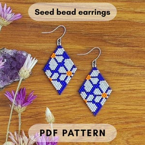 May include: Two diamond-shaped seed bead earrings with a blue background and white and orange floral patterns. The earrings have silver-colored ear wires. The text "Seed bead earrings" and "PDF PATTERN" are in the image.