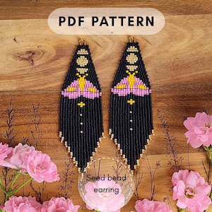 May include: A pair of long, triangular seed bead earrings featuring a black background with a pink and yellow moth design at the top and a vertical line of gold beads. The text PDF PATTERN and Seed bead earring are visible.