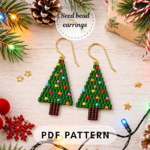 May include: A pair of Christmas tree-shaped seed bead earrings with gold-tone hooks. The earrings feature green beads for the tree, brown beads for the trunk, and multi-coloured beads representing ornaments. The image includes the text Seed bead earrings and PDF PATTERN.