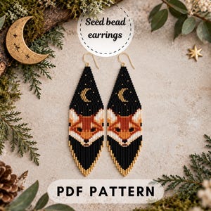 May include: A pair of long, diamond-shaped seed bead earrings featuring a fox face graphic against a black background with a crescent moon and stars. The earrings have gold-tone hooks. Text on the image reads Seed bead earrings and PDF PATTERN.