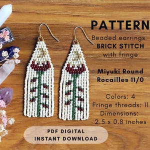 May include: Pattern for beaded earrings in brick stitch with fringe. The earrings feature a floral design in white, red, green, and gold. Dimensions are 2.5 x 0.8 inches. PDF digital instant download.