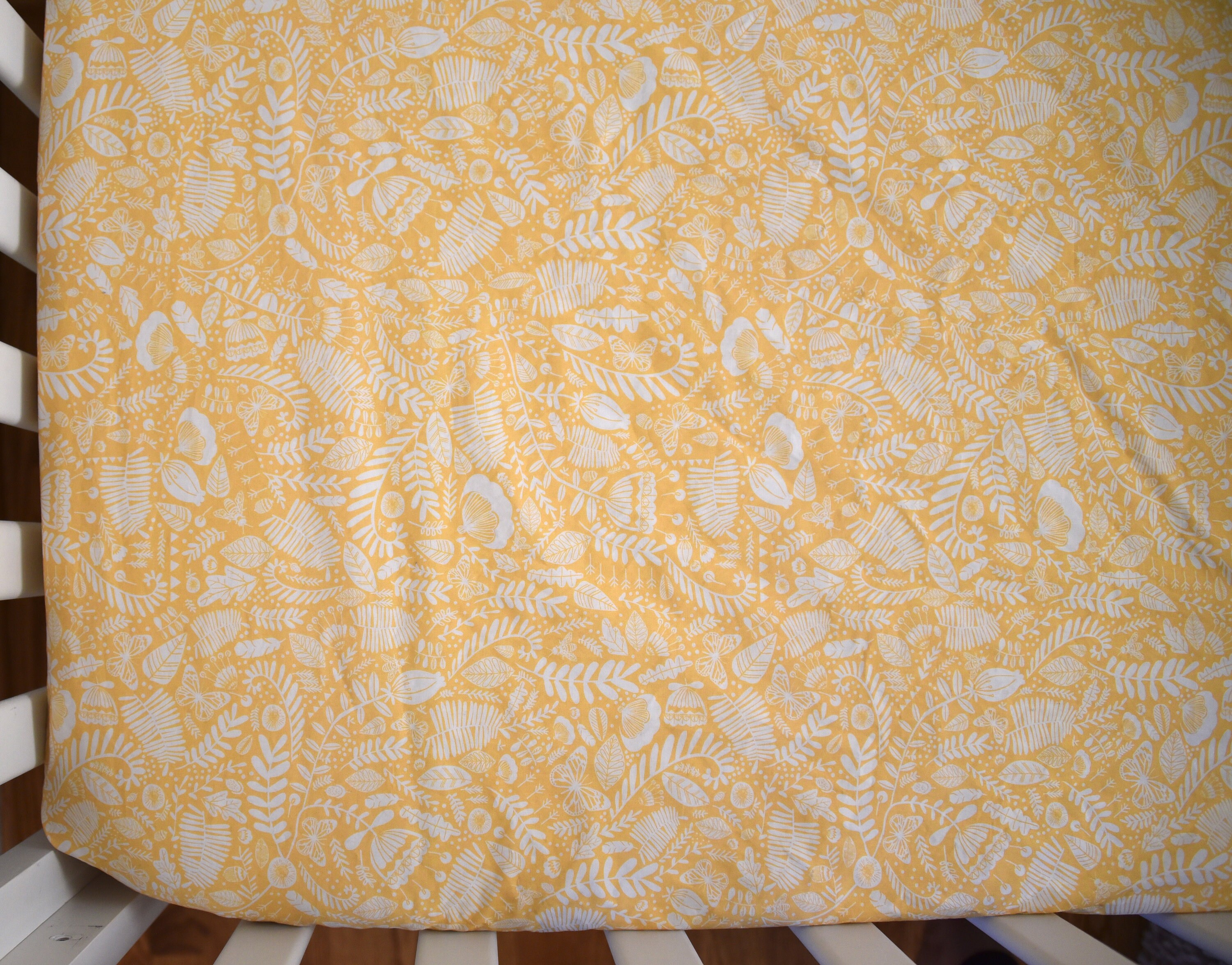 yellow crib sheet