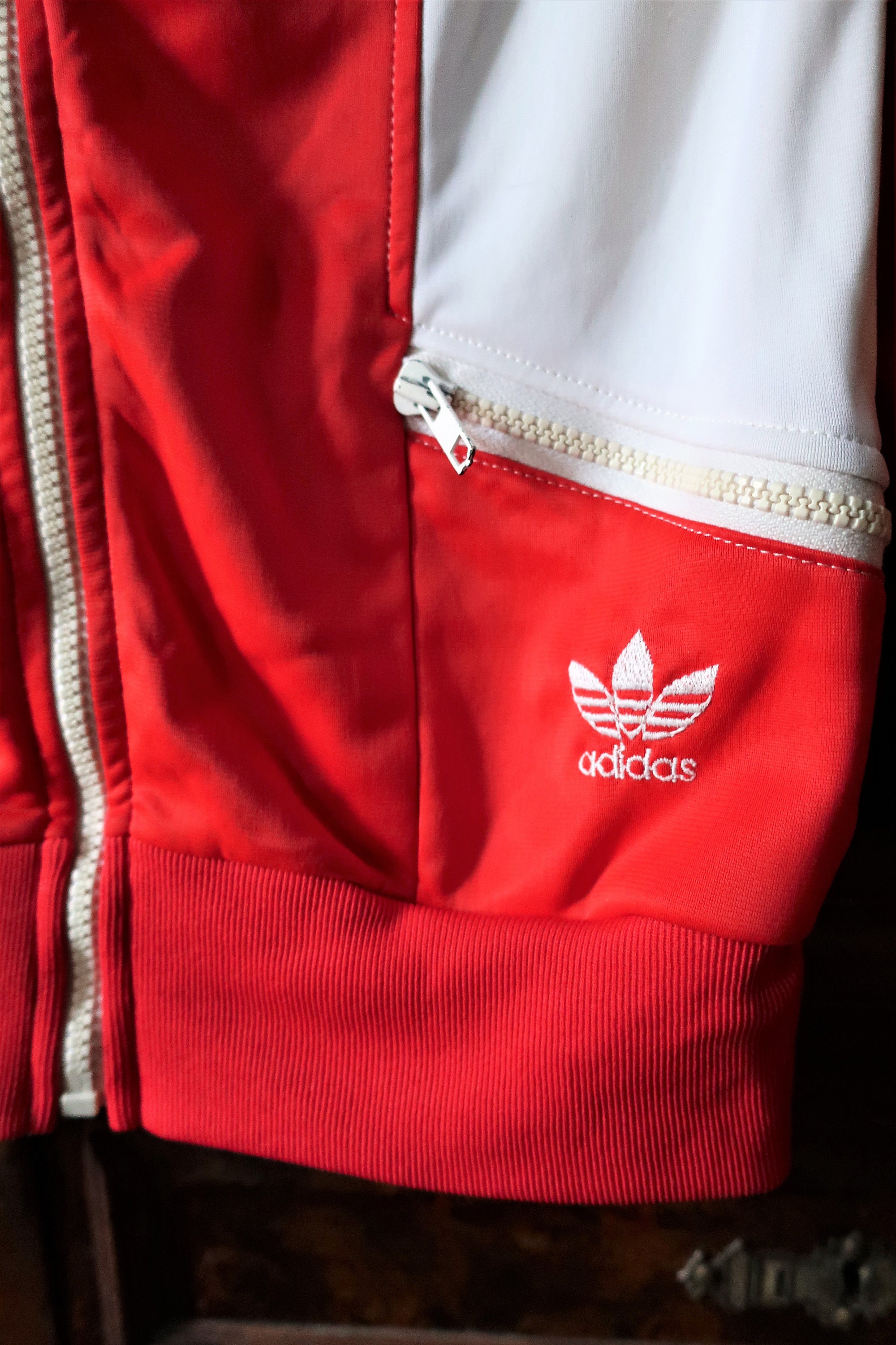 red adidas jacket with white stripes