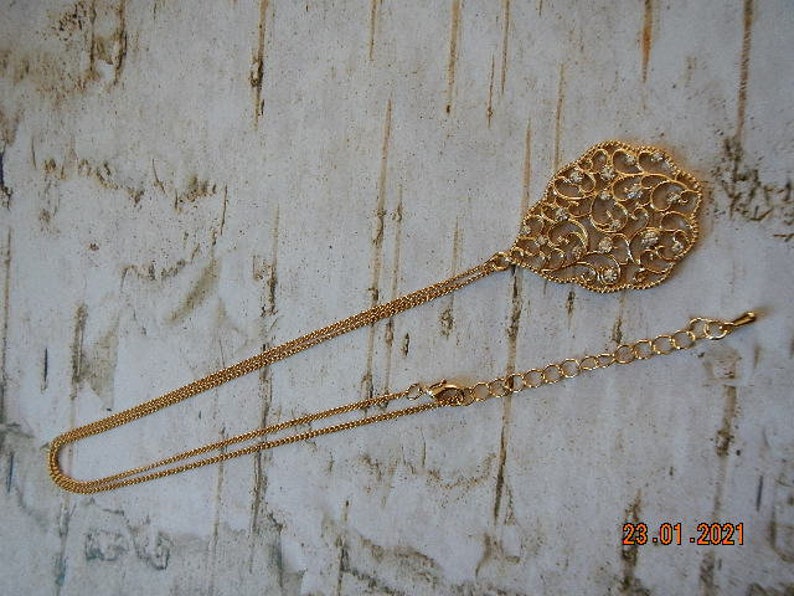 Gold-tone Sparkling Clear Rhinestone-studded Filigree Pendant Necklace