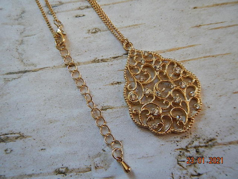 Gold-tone Sparkling Clear Rhinestone-studded Filigree Pendant Necklace