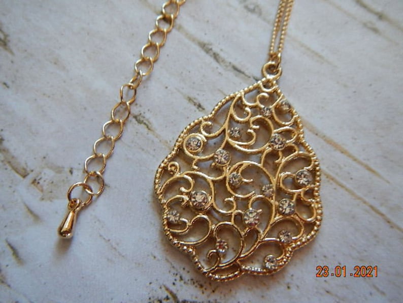 Gold-tone Sparkling Clear Rhinestone-studded Filigree Pendant Necklace