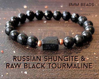 May include: Black bracelet made with 8mm beads of raw black tourmaline and Russian Shungite. The bracelet has copper spacers between the beads.