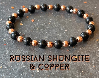 May include: A black and copper beaded bracelet with the text "RUSSIAN SHUNGITE & COPPER".