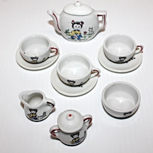 Vintage Child&#39;s Porcelain 12 Piece China Tea Set with Original Box. Girl Character Pattern. Red Trim