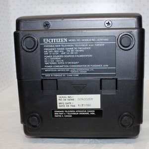 May include: Black and white portable television with the brand name Citizen and model number JCTR 146G. The television has a serial number 00400261 and a manufacturing date of May 1990. The television is made in China.