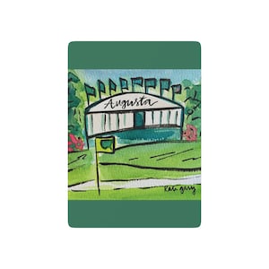 May include: A watercolor painting of a green building with the word "Augusta" written on it. There are green flags on top of the building. The building is on a green field with a green fence. The painting is signed "Rae Gary" in the bottom right corner.