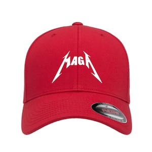 May include: A red baseball cap with the word "MAGA" in a white, stylized font. The cap has a curved brim and a Flexfit label.