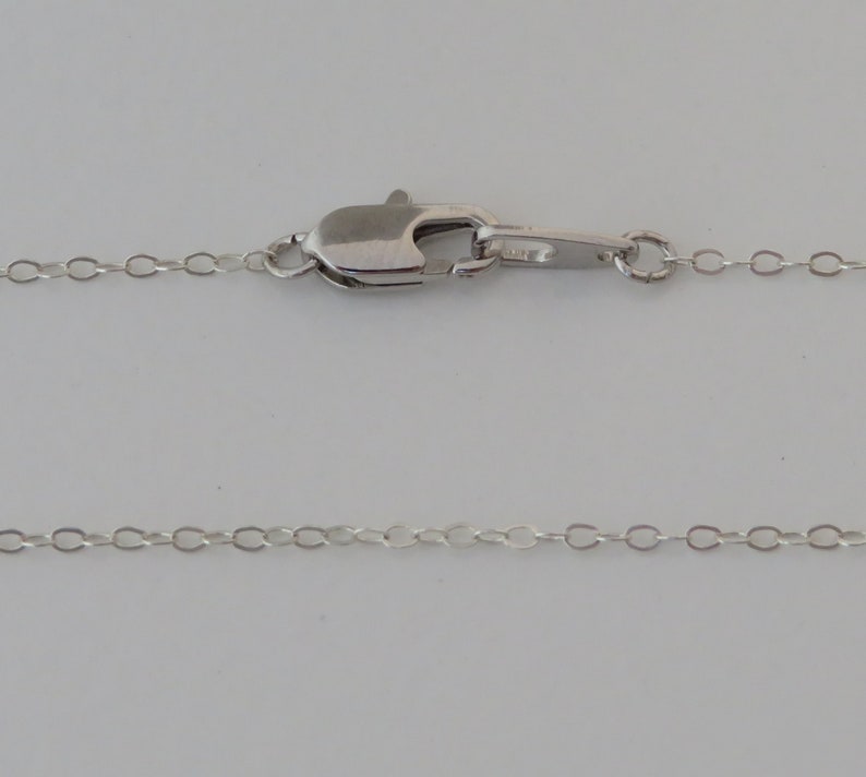 Oval Emerald Pendant on Silver Chain