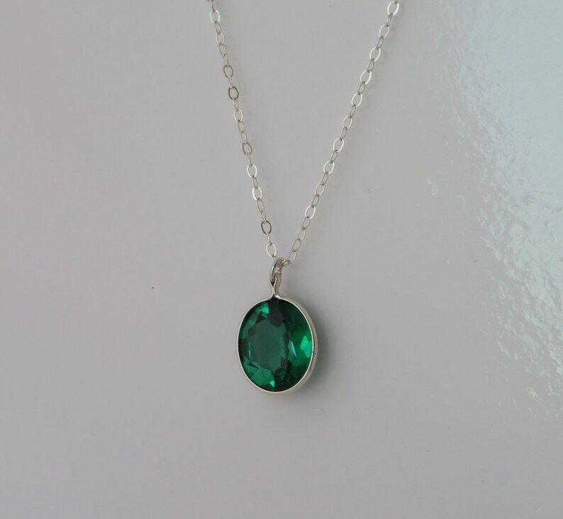 Oval Emerald Pendant on Silver Chain