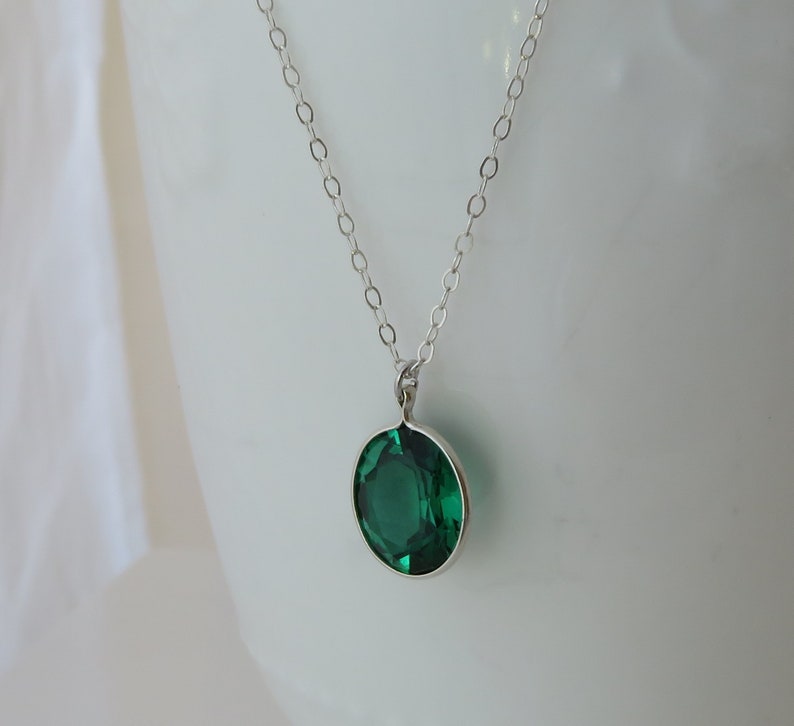 Oval Emerald Pendant on Silver Chain