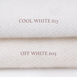 May include: Two layers of white, fine-knit, semi-sheer fabric with a textured, net-like pattern. The top layer is labeled COOL WHITE 613 in dark text, and the bottom layer is labeled OFF WHITE 605 in dark text, showing a clear color difference.