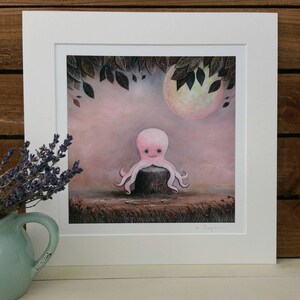 May include: A pink octopus with a smiling face sits on a tree stump in a whimsical forest scene. The background features a full moon and dark leaves.