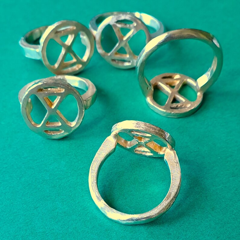 extinction rebellion ring in bronze. simple tough image 2