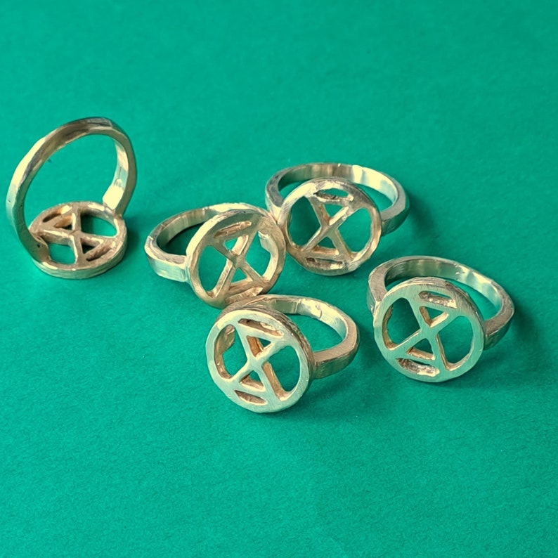 extinction rebellion ring in bronze. simple tough image 4