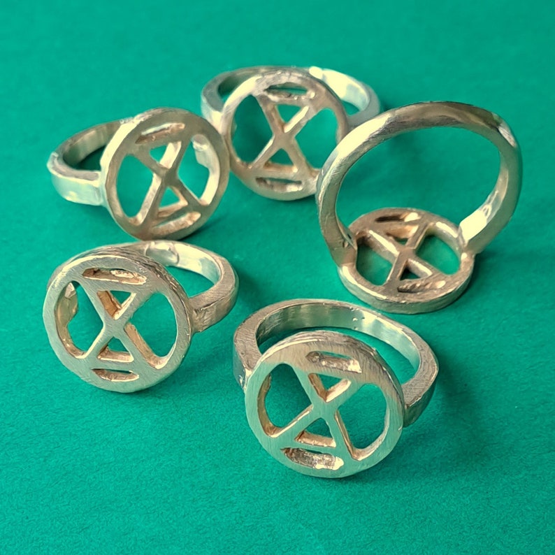 extinction rebellion ring in bronze. simple tough image 3