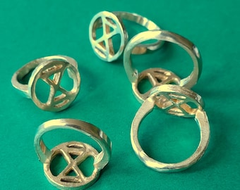 extinctionrebellion ring in bronze. simple tough