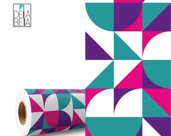 May include: A roll of geometric patterned wrapping paper with a white background and teal, purple, and pink geometric shapes. The paper is rolled up and the end is visible.