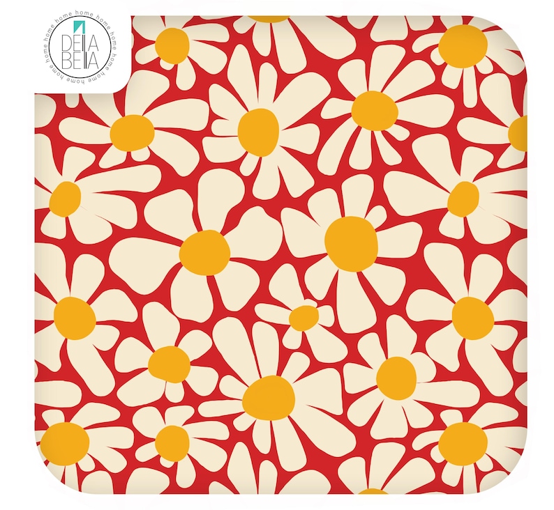 May include: A square fabric textile featuring a repeating pattern of white daisy flowers with yellow centres on a vibrant red background. The top left corner displays a circular logo with the text DELA BETA and the word home repeated around the edge.