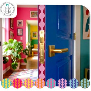 Close-up of a bright blue door featuring a pink and red wavy peel and stick vinyl door edge strip. The perfectly centered 5cm wavy wall border adds a hidden pop of colour to a maximalist dopamine decor home.
