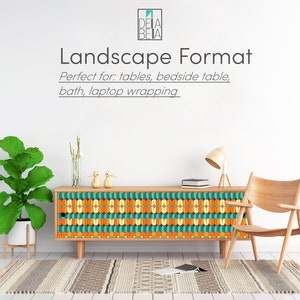 May include: A wooden cabinet with a colorful geometric pattern on the front. The cabinet is sitting on a white floor with a rug in front of it. The cabinet is decorated with a geometric pattern in shades of orange, yellow, blue, and green. The cabinet is in a room with a white wall and a chair to the right.