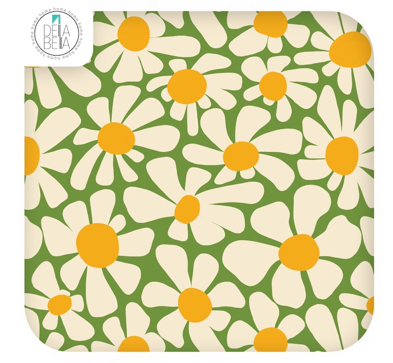May include: A square fabric textile featuring a repeating pattern of white daisy flowers with yellow centres on a solid green background. The top left corner displays a circular logo with the text DELA BETA and the word home repeated around the edge.