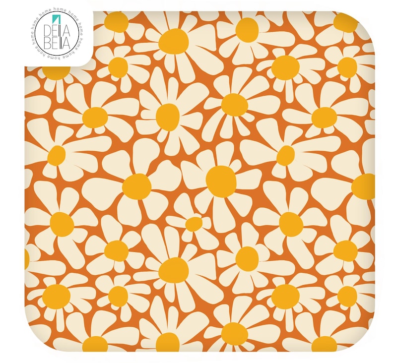 May include: A square fabric swatch featuring a repeating pattern of white daisy flowers with bright yellow centres against a solid burnt orange background. The top left corner displays a circular logo with the text DELA BETA.
