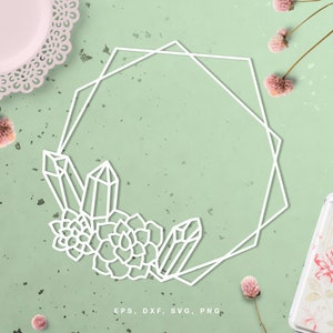 May include: A white geometric frame with a crystal and succulent design. The frame is on a light green background with pink flowers.