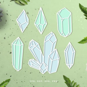 May include: A set of seven blue and green crystal shapes, including a cluster of five crystals, a single crystal, and two individual crystals. The crystals are outlined in white and have a light blue and green color scheme.