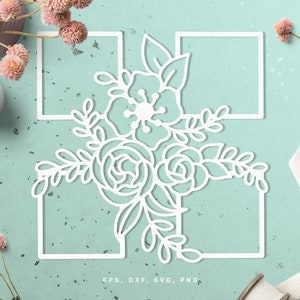 May include: White floral design with a square frame, perfect for crafting projects, scrapbooking, or card making.  The design features a bouquet of flowers with leaves and stems.