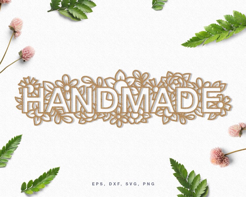 May include: A white "HANDMADE" text design with a floral border. The text is outlined in brown and the flowers are a light brown color.
