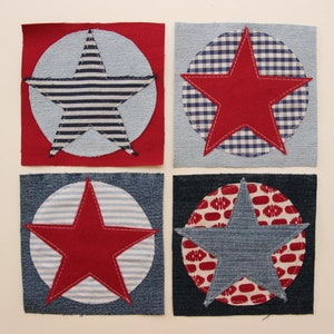 May include: Four fabric squares with red and blue stars in the centre of each. The stars are surrounded by circles of different patterned fabrics.